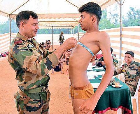 An army man measures a candidate during a recruitment rally. Image used for representational purpose only. (Photo | B P Deepu)