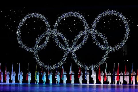 The Olympic rings during the closing ceremony of the 2022 Winter Olympics. ( Photo | AP)