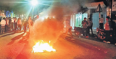 Irate BJP workers burn a tyre in Baripada protesting foul play after polling | Express