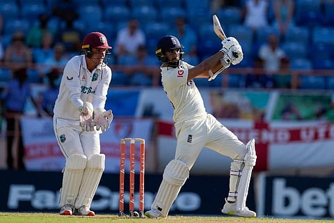 England's Saqib Mahmood hits a four against West Indies during day one of their third Test cricket match at the National Cricket Stadium in St. George, Grenada. ( Photo | AP)