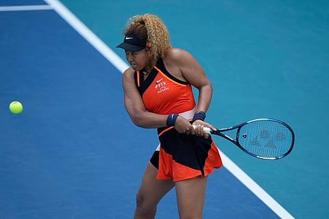 Naomi Osaka of Japan plays a ball in her second round women's match against Angelique Kerber of Germany at the Miami Open tennis tournament. ( Photo | AP)