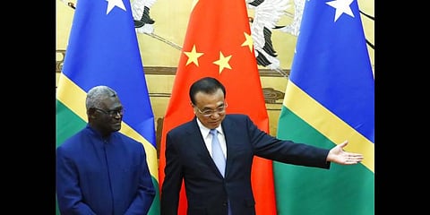 Solomon Islands Prime Minister left, and Chinese Premier Li Keqiang attend a signing ceremony at the Great Hall of the People in Beijing, on Oct 2019(Photo | AP)