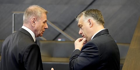 Hungarian Prime Minister Viktor Orban, right, speaks with a member of his delegation prior to a round table meeting during an extraordinary NATO summit March 24,2022.(Photo | AP)