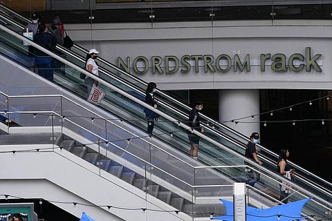People wear face masks as they shop at the Nordstrom Local DTLA downtown Los Angeles on Tuesday, March 15, 2022(Photo | AP)