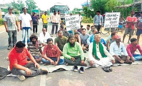 Villagers blocking Kendrapara-Chandabali State highway at Aul on Friday | Express