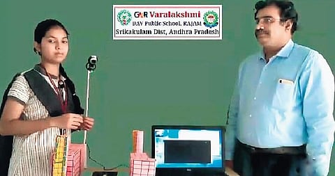 Sivvam Kiran Kumar and his student with the fire detection model | Express