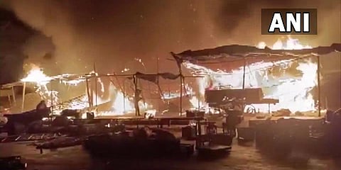 Fire at a grain market in Lucknow's Aliganj area. (Photo| ANI)