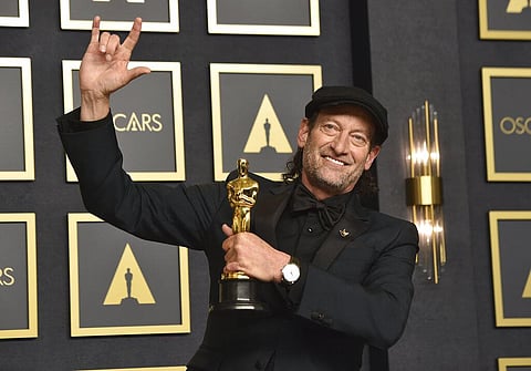 Troy Kotsur, winner of the award for best performance by an actor in a supporting role for 'CODA,' poses in the press room at the Oscars 2022(Photo | AP)