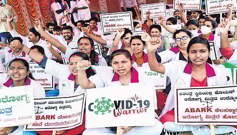 Health workers, who had been on the frontlines during the peak of the Covid pandemic, stage a protest demanding that the state government regularise their service, at Freedom Park in Bengaluru on Mond
