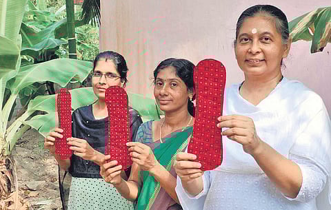 Anju Bist and her team with the world’s first reusable menstrual pads they made from banana fibre, which comes from agro-waste
