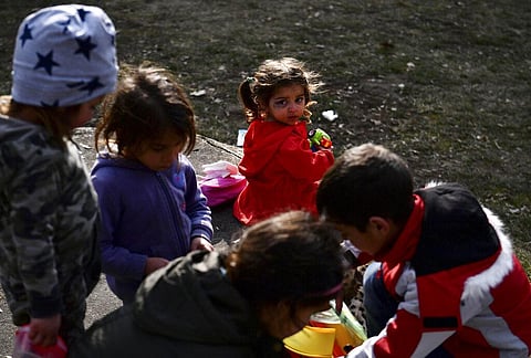 A small girl, center, plays with other children outside of a temporary shelter for displaced persons from Ukraine, in Beregsurany, Hungary. (Photo | AP)