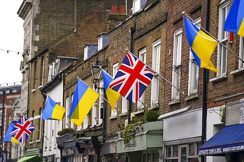 Ukrainian flags are flown from properties along Church Street, Twickenham, in southwest London. (Photo | AP)