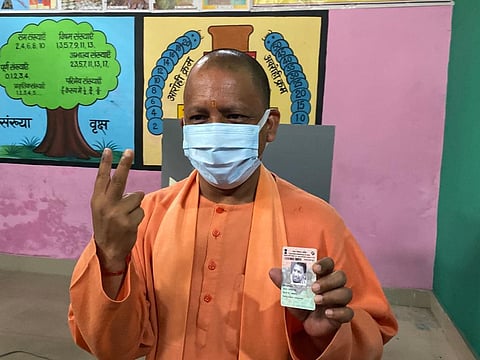 Chief Minister Yogi Adityanath at polling booth to cast his vote in Gorakhpur, for the sixth phase of the Uttar Pradesh Assembly polls on Thursday. (Photo | EPS)