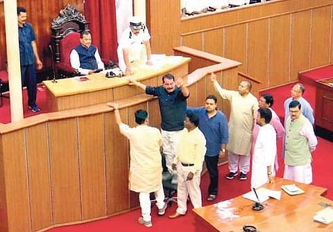 Congress members led by Opposition chief whip Taraprasad Bahinipati tried to climb up the podium of Speaker Pradip Amat. ( File Photo)