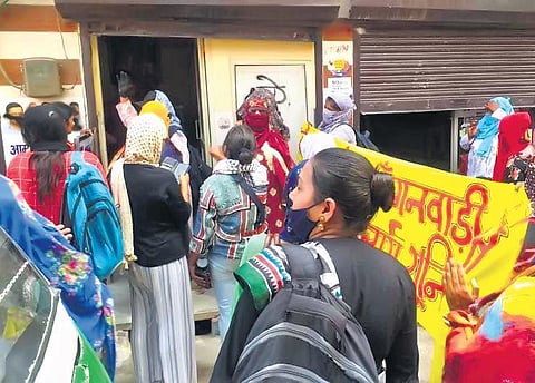 Anganwadi workers protest outside AAP and BJP offices demanding removal of ESMA | express