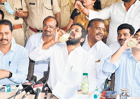 Excise Minister V Srinivas Goud and other officials take a sip of Neera during the inspection for the proposed cafe in PVNR Marg on Wednesday. ( File Photo)