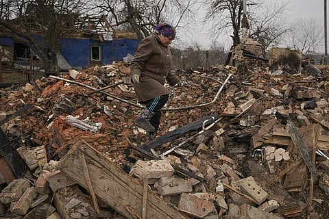 Mariya, a local resident, looks for personal items in the rubble of her house, destroyed during fighting between Russian and Ukrainian forces in the village of Yasnohorodka. (Photo | AP)