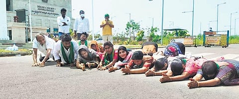 Hailing the verdict, Amaravati farmers prostrate in front of the Andhra Pradesh High Court at Amaravati on Thursday | Express