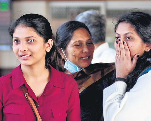 Neha Eldose and Sandra Santhosh who reached Kerala from Ukraine sharing their happiness at the Kochi airport on Thursday | A Sanesh