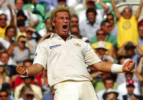 Australia's Shane Warne celebrates after he caught and bowled England's Andrew Flintoff for 8 runs during the final day of the fifth npower Test match at the Brit Oval. (Photo | AP)