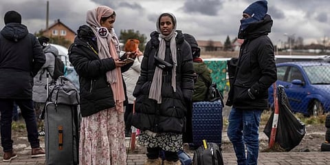 Indians wait for transport as refugees from many countries, mostly students of Ukrainian universities arrive at the Medyka pedestrian border crossing fleeing the conflict in Ukraine. (Photo | AP)