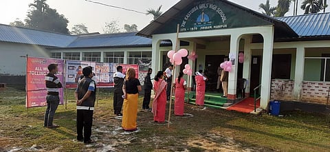 Voters stand in queues to cast their vote while maintaining social distancing amid the COVID-19 pandemic in Manipur on Saturday. (Photo | ANI Twitter)
