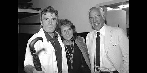 Actor Lee Marvin, right, and his wife, Pamela, visit with Mitchell Ryan, star of Arthur Miller's play 'The Price,' backstage at the Playhouse Theater in New York in July 1979(File photo | AP)