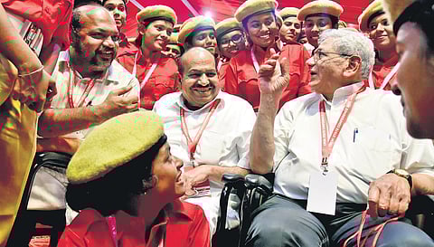 CPM general secretary Sitaram Yechury, state secretary Kodiyeri Balakrishnan and Industries Minister P Rajeeve interact with red volunteers at the venue of the state conference | Albin Mathew