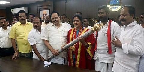 Water Resources Minister Duraimurugan hands the sceptre to Vellore mayor Sujatha Anandakumar in Vellore on Friday. | S Dinesh