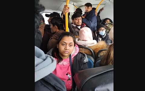 A batch of students including Glenwill from Udupi moving in a bus arranged by Indian Embassy from Pisochyn to Hungary border on Saturday. (Photo | EPS)