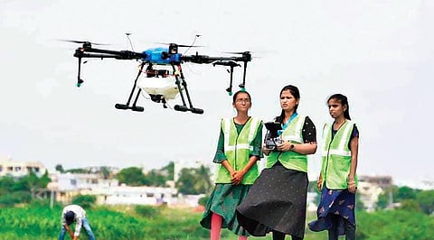 Blubot Robotics CEO K Hari Priya Reddy using drones to spray chemical on crops. (Photo| EPS)