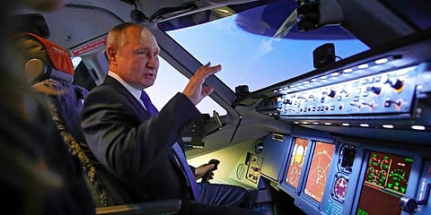 Russian President Vladimir Putin sits in the cockpit of an airplane simulator as he visits Aeroflot Aviation School outside Moscow, Russia, Saturday, March 5, 2022. (Photo | AP)