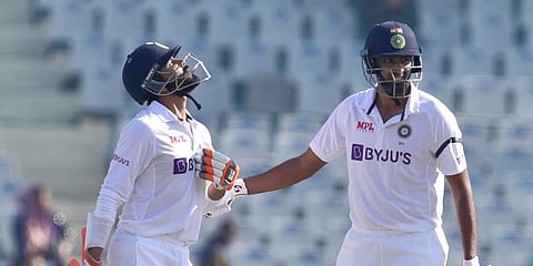 India’s Ravichandran Ashwin congratulates teammate Ravindra Jadeja after the latter scored a half-century, during the 2nd day of the 1st test cricket match between India and Sri Lanka. (PTI)