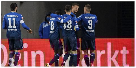 Hoffenheim's Stefan Posch, second right, celebrates scoring the first goal of the game during the German Bundesliga soccer match between 1. FC Cologne and TSG 1899 Hoffenheim at RheinEnergieStadion.