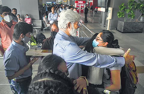 An Indian student, evacuated from war-torn Ukraine, being welcomed by her family upon her arrival at Delhi’s IGI Airport. (Photo | PTI)