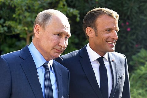 French President Emmanuel Macron, right, welcomes Russian President Vladimir Putin at the Fort of Bregancon in Bormes-les-Mimosas, southern France. (Photo | AP)