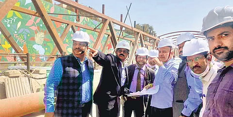 Deputy CM Manish Sisodia with PWD officials at the construction site. (Photo | EPS)