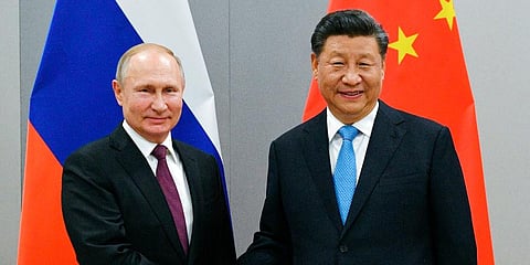 Russia President Vladimir Putin (L) with his Chinese counterpart Xi Jinping (Photo | AP)