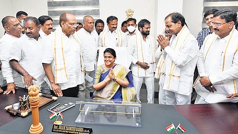 A smiling Collector Shaikh Yasmeen Basha sits in her chair as Chief Minister K Chandrasekhar Rao, ministers and officials look on after the inauguration of the Integrated District Collector’s Office C