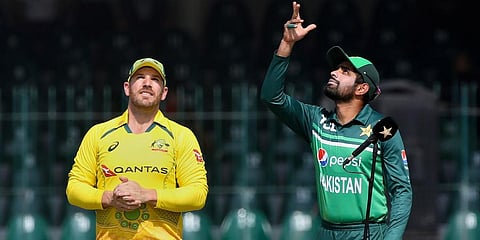 Pakistan skipper Babar Azam (R) and his Australian counterpart Aaron Finch (Photo | AP)