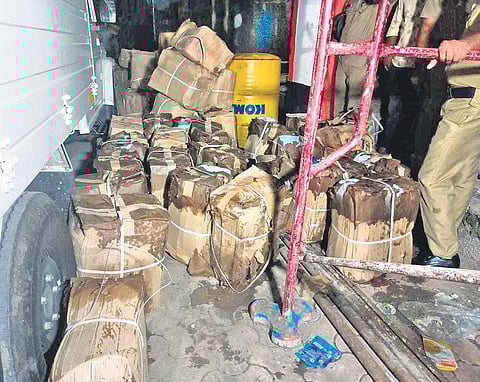 Cans containing spirit seized by the Excise from the underground rainwater tank of JK Enterprise at the Edayar industrial area near Aluva | EXPRESS