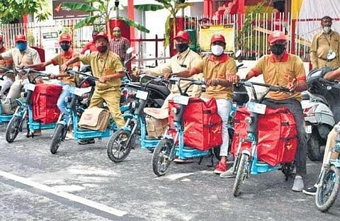 Archive pic when Yulu bikes were trialled at JP Nagar sub post office during Postal Week celebrations last year. ( Photo | EPS))