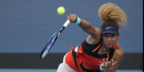 Naomi Osaka of Japan serves in her women's semifinal match against Belinda Bencic of Switzerland, at the Miami Open tennis tournament, Thursday, March 31, 2022.(Photo | AP)