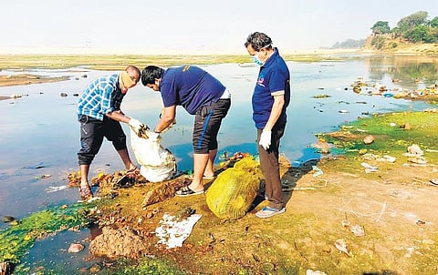 Volunteers removing garbage from the river bank | Express