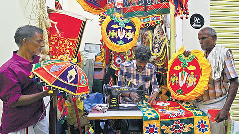 Tailors busy stitching colourful costumes in Kunnathur Chathiram for devotees attending Chithirai festival | k k sundar