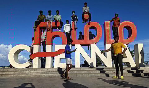 People climb over the Namma Chennai selfie structure at Kamarajar Promenade in Chennai. (Photo | Debadatta Mallick, EPS)