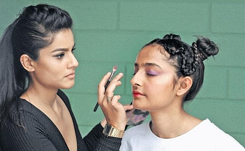 Carol Menezes with a client