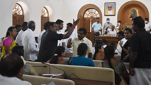AIADMK ward councillor Prabhakaran arguing with DMK councillors during the first CCMC council meeting in Victoria Hall. (Photo | S Senbagapandiyan, EPS)