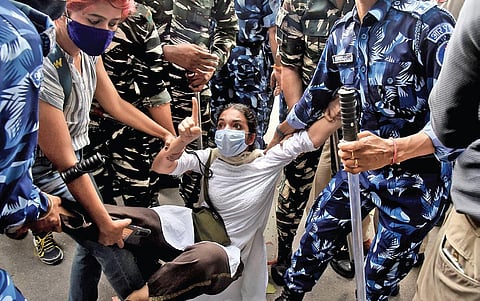 A student being detained for participating in a protest against hate speech at Parliament Street on August, 2021. (File Photo| Parveen Negi)