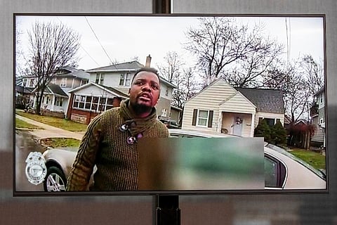 A TV display shows video evidence of a Grand Rapids police officer struggling with and shooting Patrick Lyoya at Grand Rapids City Hall on Wednesday. ( Photo | AP)
